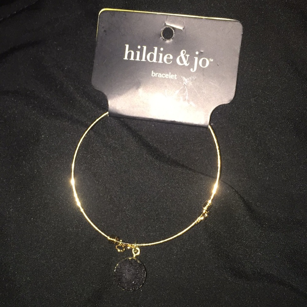 Gold charm bracelet with black crystal